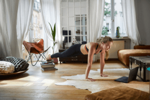 A woman working out in the living room