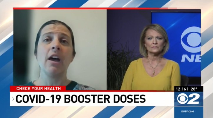 Two women talking about Covid-19 booster doses